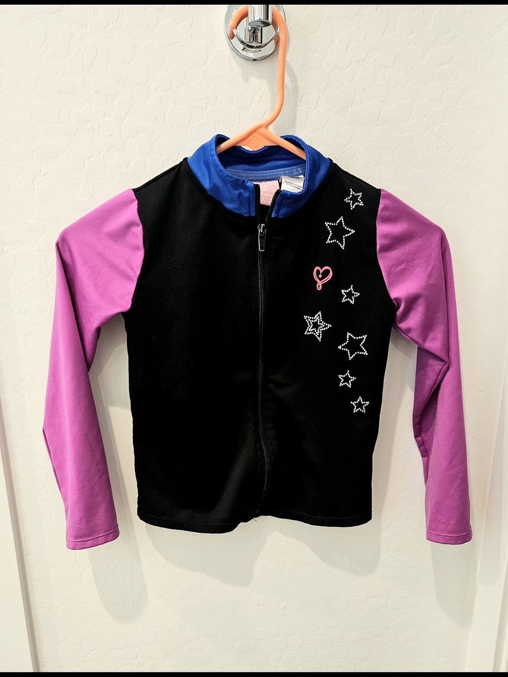 Jojo Siwa Girls Black Zip-Up Jacket with Purple Sleeves and Blue Collar